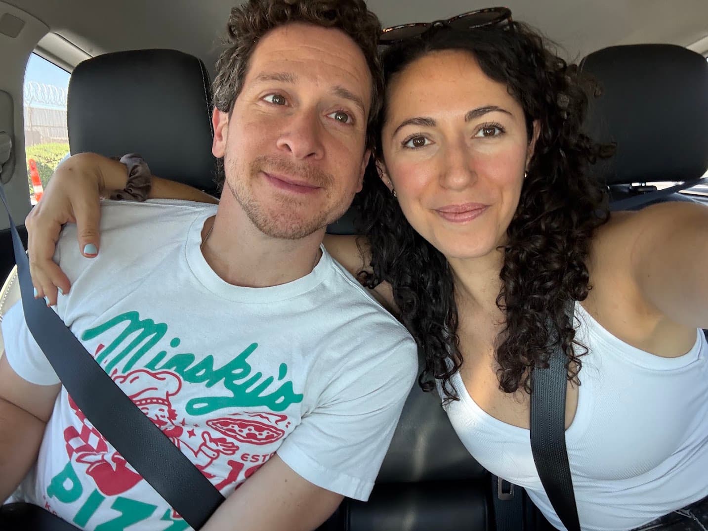 Julia and Shane Kanter together in the back seat of a car